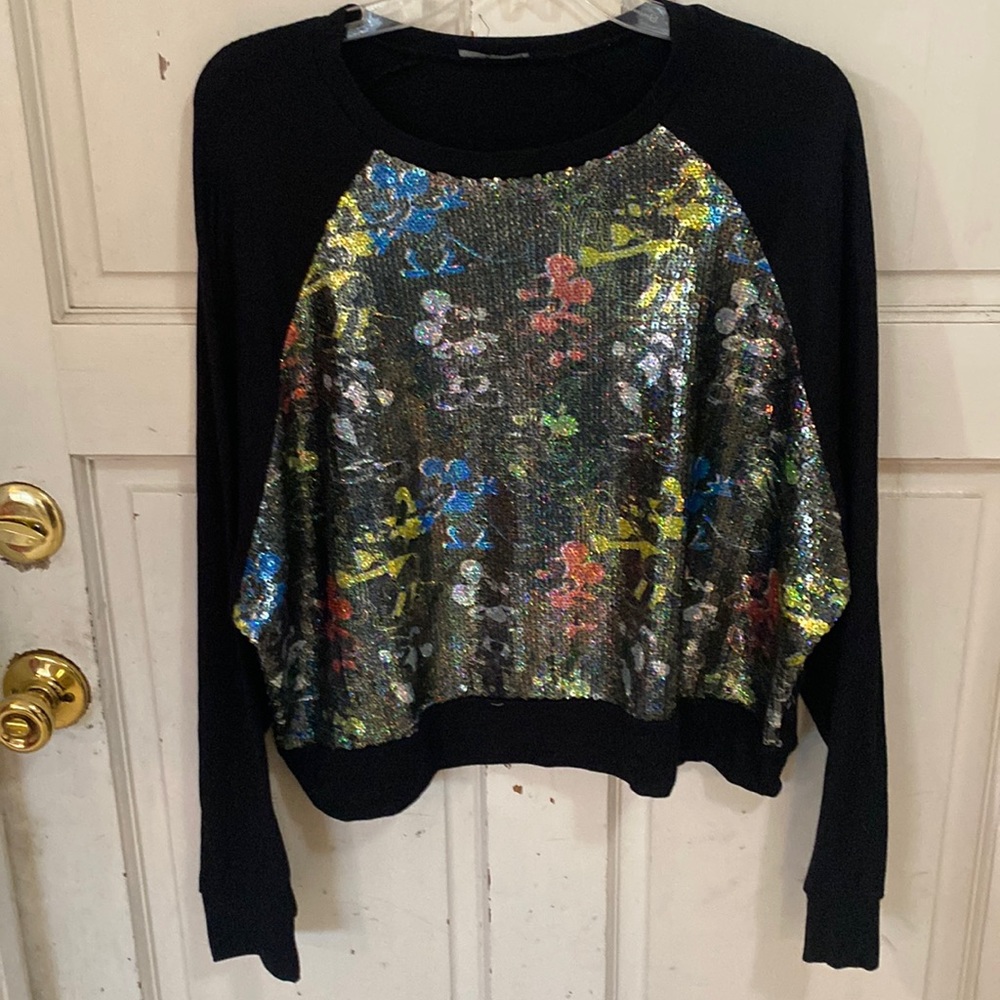 Disney waist length sweat shirt with sequined front of Mickey Mouse.